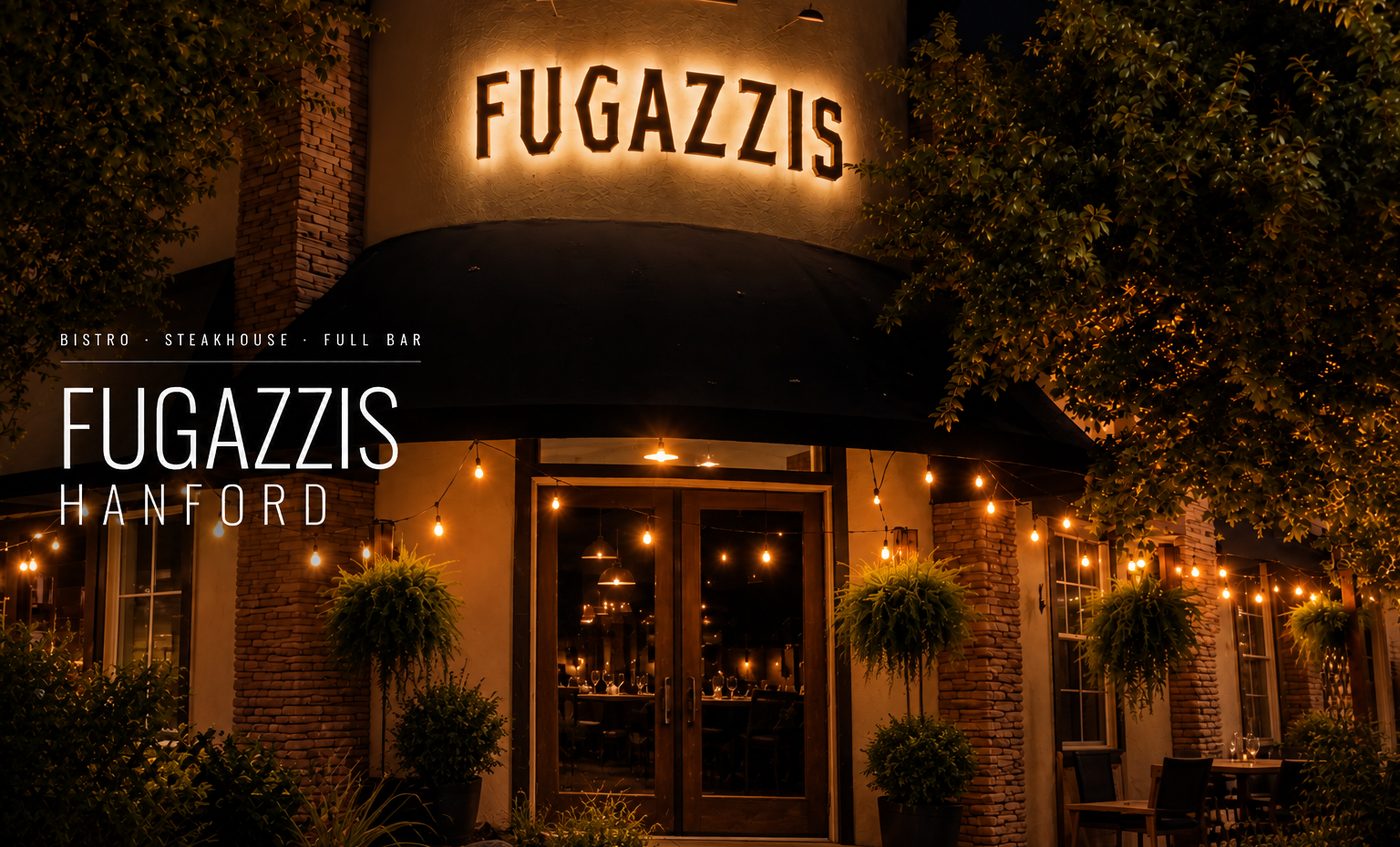 The lit Fugazzis sign over the patio in downtown Hanford at night